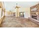 Sunroom features stone fireplace, tile floors, and access to outdoors via sliding glass doors at 2037 Lakeshore Dr, Mount Dora, FL 32757