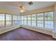 Sunroom boasting many windows overlooking the pool and back yard area at 2037 Lakeshore Dr, Mount Dora, FL 32757