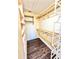 Walk-in closet featuring wood shelves and wood laminate flooring at 2037 Lakeshore Dr, Mount Dora, FL 32757