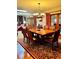Formal dining room featuring a wood table, chandelier lighting, and wood floors at 2121 Suzanne Dr, Mount Dora, FL 32757