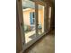 A home's foyer with access to the front porch is shown through the interior french doors at 2121 Suzanne Dr, Mount Dora, FL 32757