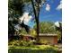 Inviting single-story home showcasing a well-manicured yard, a two-car garage, and a cozy, vintage charm at 2121 Suzanne Dr, Mount Dora, FL 32757