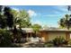Charming single Gathering home with a white picket fence and lush landscaping and an attached garage at 2121 Suzanne Dr, Mount Dora, FL 32757