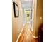 Hallway features hardwood floors and neutral wall colors at 2121 Suzanne Dr, Mount Dora, FL 32757
