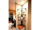 Hallway showcasing decorative glass shelves and a view of the bedroom area beyond at 2121 Suzanne Dr, Mount Dora, FL 32757