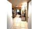Hallway leading to the bedroom area with tile floors, built-in shelving, and natural light at 2121 Suzanne Dr, Mount Dora, FL 32757