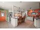 Modern kitchen featuring an island with seating, stainless steel appliances, and stylish cabinetry at 2121 Suzanne Dr, Mount Dora, FL 32757