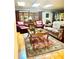 Comfortable living room with wood floors, skylights and traditional furniture. Natural light at 2121 Suzanne Dr, Mount Dora, FL 32757