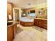 The main bath features a shower, soaking tub, dual sinks, and tile floors at 2121 Suzanne Dr, Mount Dora, FL 32757