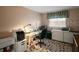 Well-lit home office with large desk and ample storage space at 2121 Suzanne Dr, Mount Dora, FL 32757
