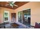 Relaxing screened patio with ceiling fan and sliding glass doors at 2121 Suzanne Dr, Mount Dora, FL 32757