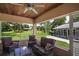 Inviting screened patio with outdoor seating offering scenic views at 2121 Suzanne Dr, Mount Dora, FL 32757