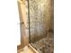 Walk-in shower featuring decorative tile, a glass surround, and a built-in bench at 2121 Suzanne Dr, Mount Dora, FL 32757