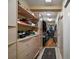 Spacious walk-in closet with custom shelving and ample storage space for clothes and accessories at 2121 Suzanne Dr, Mount Dora, FL 32757