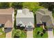 Charming home with well-maintained lawn, lovely landscaping, neutral roof, and inviting driveway at 2204 Margarita Dr, The Villages, FL 32159