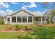 Back exterior view showing the golf course behind the home at 2204 Margarita Dr, The Villages, FL 32159