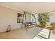 Cozy back porch with a swing and nice view of the backyard at 2204 Margarita Dr, The Villages, FL 32159