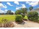 Landscaped backyard with nice view of the golf course at 2204 Margarita Dr, The Villages, FL 32159