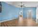Bright, open bedroom with wood floors and ensuite access to a well-lit bathroom at 2204 Margarita Dr, The Villages, FL 32159