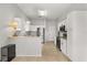Bright kitchen featuring stainless steel appliances, white cabinetry, and tile flooring at 2204 Margarita Dr, The Villages, FL 32159