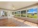 Light-filled sunroom with expansive windows offering panoramic views of the golf course at 2204 Margarita Dr, The Villages, FL 32159