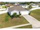 Charming single-story home with an attached garage, well-kept lawn, and inviting curb appeal at 2256 Gladiolus Ln, Mascotte, FL 34753