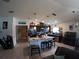 Open kitchen with island seating, stainless steel appliances and light wood flooring at 2256 Gladiolus Ln, Mascotte, FL 34753