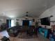Spacious living room featuring vaulted ceilings and a comfortable sectional sofa at 2256 Gladiolus Ln, Mascotte, FL 34753