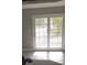 Sunlit room featuring white french doors with views of the outdoor balcony at 234 Afton Sq # 205, Altamonte Springs, FL 32714