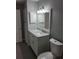 Bathroom with a modern vanity, large mirror, overhead lighting, and gray walls at 234 Afton Sq # 305, Altamonte Springs, FL 32714