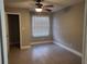 This bedroom features tile flooring, a window and ceiling fan at 234 Afton Sq # 305, Altamonte Springs, FL 32714