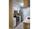 Well-lit kitchen with stainless steel appliances, white cabinets, and sleek countertops at 234 Afton Sq # 305, Altamonte Springs, FL 32714