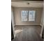 Sun-filled room with attractive new laminate floors, neutral walls, white trim, and sunny windows with blinds at 236 Afton Sq # 309, Altamonte Springs, FL 32714