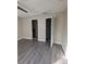 Neutral bedroom featuring new laminate floors, white trim, and convenient access to an en-suite bathroom and closet at 236 Afton Sq # 309, Altamonte Springs, FL 32714