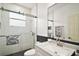 The bathroom features a glass shower door, a granite vanity, and modern fixtures at 2497 Heritage Green Ave, Davenport, FL 33837