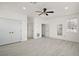 A bright bedroom offers ample closet space, modern floors, and neutral tones at 2497 Heritage Green Ave, Davenport, FL 33837