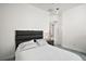Bedroom featuring neutral tones, a black headboard, and a carpeted floor at 2497 Heritage Green Ave, Davenport, FL 33837