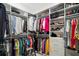 A spacious walk-in closet with ample shelving and hanging space for clothes and accessories at 2497 Heritage Green Ave, Davenport, FL 33837