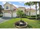 Charming home with well-maintained lawn and decorative landscaping in a desirable neighborhood at 2497 Heritage Green Ave, Davenport, FL 33837