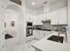 Stylish kitchen featuring white cabinets, stainless appliances, and elegant countertops at 2497 Heritage Green Ave, Davenport, FL 33837