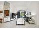 Bright living room boasts high ceilings, modern decor, and access to the screened patio at 2497 Heritage Green Ave, Davenport, FL 33837