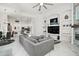 Spacious living area with kitchen and dining room, featuring an entertainment center at 2497 Heritage Green Ave, Davenport, FL 33837