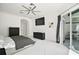 Spacious main bedroom featuring light walls, and modern decor with sliding doors to outdoor kitchen at 2497 Heritage Green Ave, Davenport, FL 33837