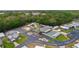 Overhead perspective of the community clubhouse, pool, and recreational areas surrounded by greenery at 25 Captains Pt, Fruitland Park, FL 34731
