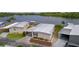 Scenic aerial view of a comfortable lakeside home with ample parking spaces at 25 Captains Pt, Fruitland Park, FL 34731