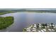 Stunning aerial view of a community by the water, offering a serene living environment at 25 Captains Pt, Fruitland Park, FL 34731