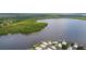 Aerial view of a lakeside community with boat slips and beautiful homes at 25 Captains Pt, Fruitland Park, FL 34731