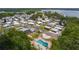 Aerial view showcasing the community pool, clubhouse, and well-maintained landscaping at 25 Captains Pt, Fruitland Park, FL 34731