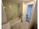 Bathroom with a bath tub and neutral tile at 25 Captains Pt, Fruitland Park, FL 34731