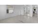 Bright bedroom with white walls and mirrored closet doors at 25 Captains Pt, Fruitland Park, FL 34731